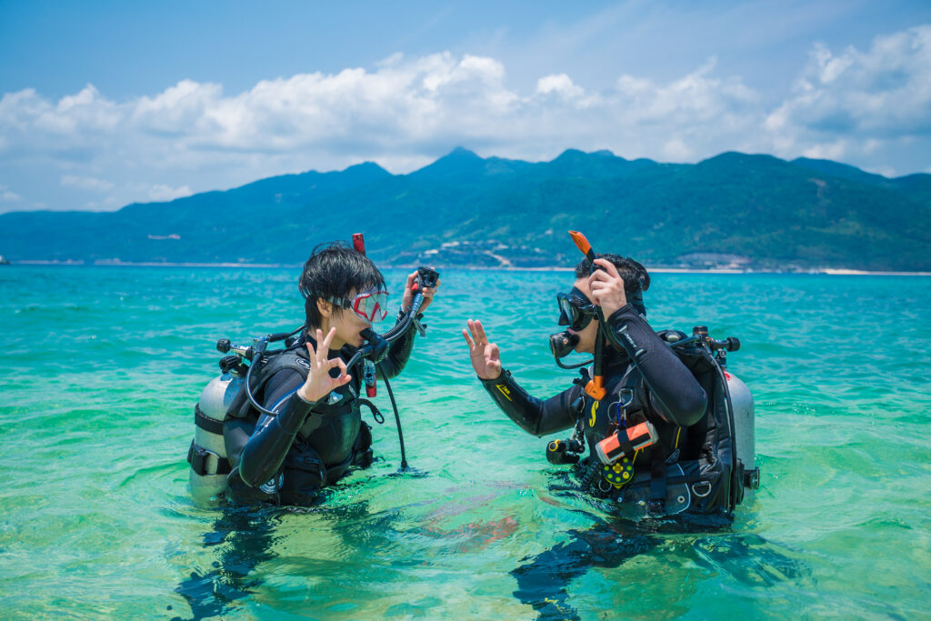PADI divers doing confined water by the beach